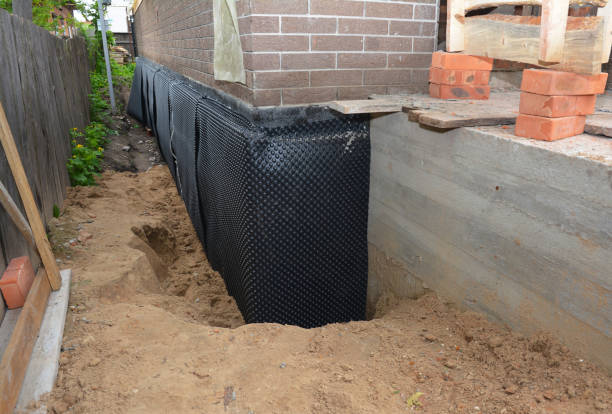 Happy homeowners after waterproofing job in Doyle